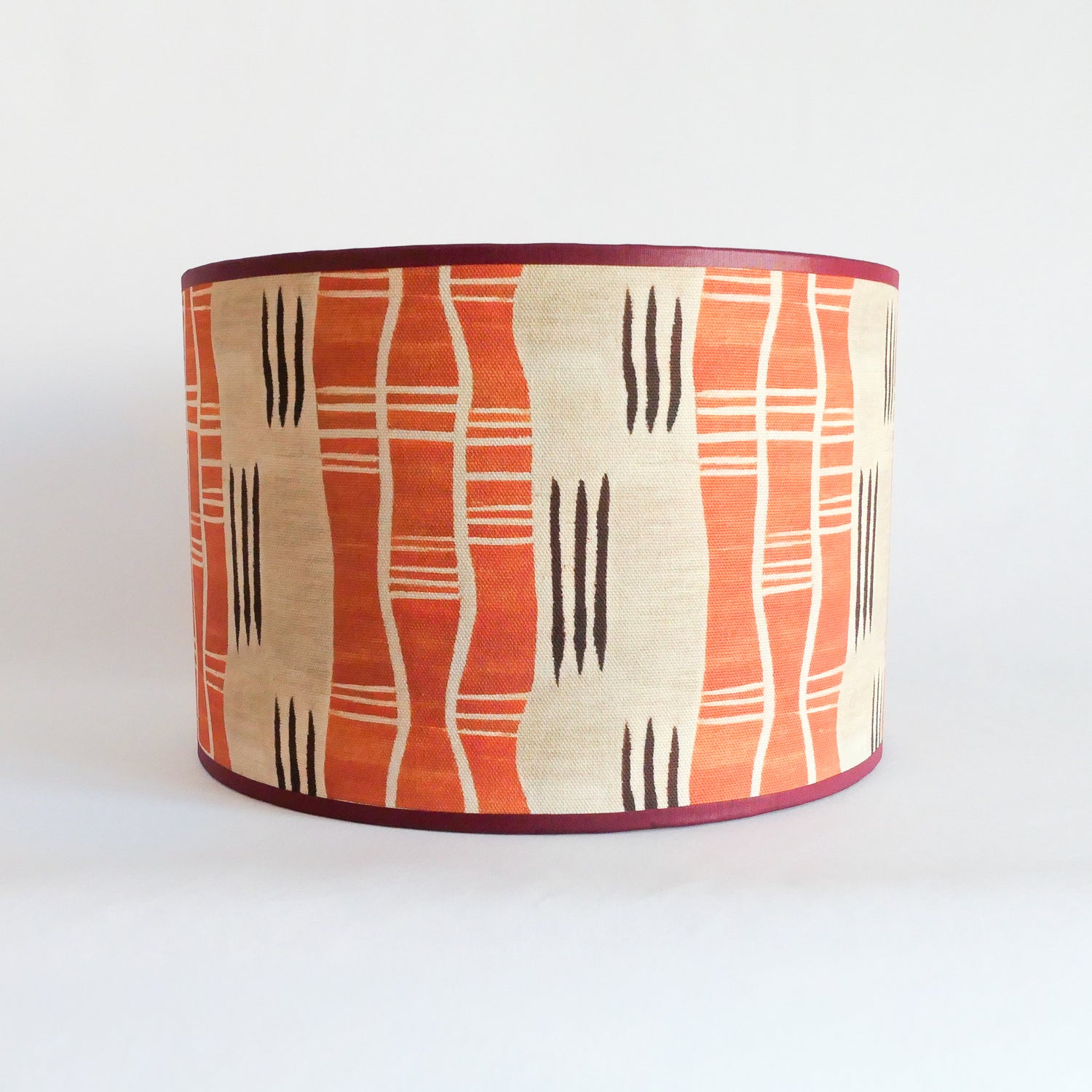 Front view of a lampshade with an African pattern on a white background